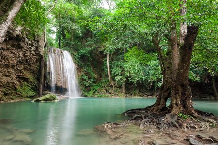Deep forest waterfall at Erawan waterfall National Park Kanchanaburi Thailandの写真素材