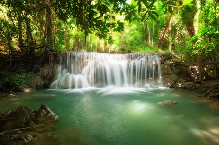 Deep forest waterfall at Huay Mae Kamin waterfall National Park Kanchanaburi Thailandの写真素材