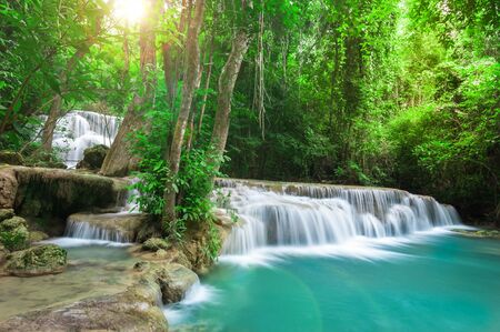 Deep forest waterfall at Huay Mae Kamin waterfall National Park Kanchanaburi Thailandの写真素材