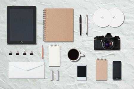 Mock up template of office equipment and stationary on white cement floor