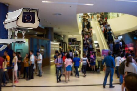 CCTV camera or surveillance operating with crowded people in background
