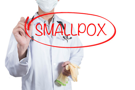 Doctor using red pen draw circle on smallpox disease