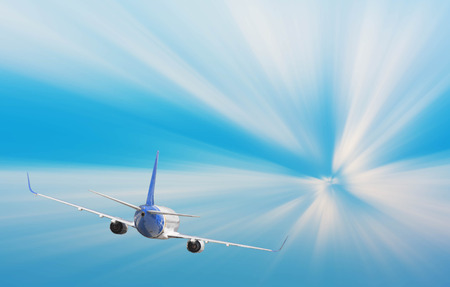 Airplane with background of sunburst sky at sunset or sunrise, exploration conceptual