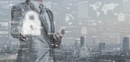 Business man in grey suit point on lock icon, data security concept, big data management conceptual