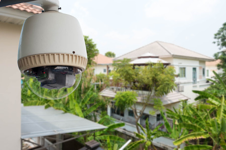 Home security comcept, CCTV camera or surveillance operating in village