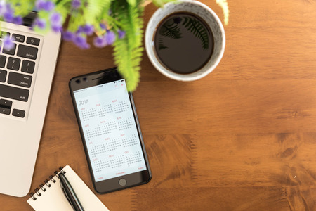 Bangkok ,Thailand DECEMBER 04, 2016 : Iphone 7 Plus jet black series show calendar of 2017 on screenのeditorial素材