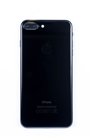 BANGKOK, THAILAND - NOVEMBER 20, 2016: Iphone7 Plus jet black series rear view on white plain floor, new generation of smartphone, smartphone without headphone jackのeditorial素材