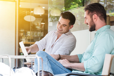 Two Westerner Business men working with laptop and smartphone togetherの写真素材