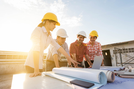 Four construction engineer working in construction site, construction engineering conceptualの写真素材