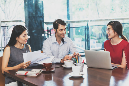 3 people meeting in coffee shop, business casual conceptualの写真素材