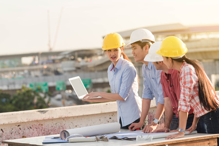 Four construction engineer working in construction site, construction engineering conceptualの写真素材
