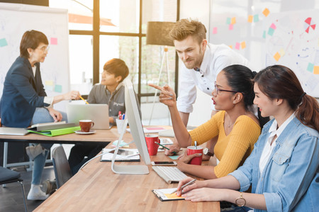 group of five multi generation of creative work place, modern style of work, entrepreneur group brainstorming multi generation of creative work place, modern style of workの写真素材