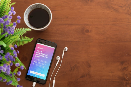 Bangkok ,Thailand DECEMBER 04, 2016 : Iphone 7 Plus jet black series with apple music application on screenのeditorial素材