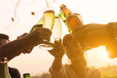 Group of 6 teenager have dinner party celebrating at sunset with beautiful landscape backgroundの写真素材