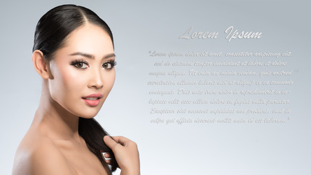 Beauty shot of young pretty asian woman with clear skin ongrey background, for skin ad and cosmetologyの写真素材