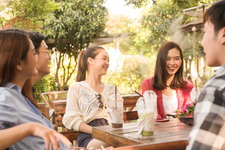 Group of friends hang out in cafe