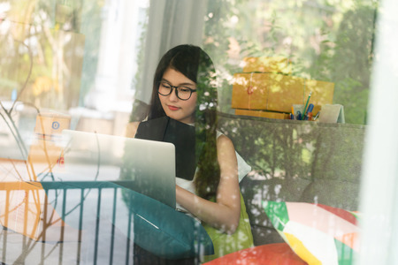 Young asian woman entrepreneur, teenager business owner work at home, alpha generation life style,...