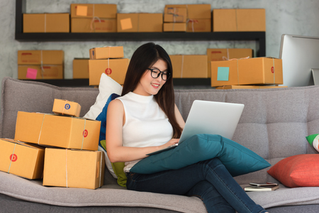 Young asian woman entrepreneur, teenager business owner work at home, alpha generation life style, online business conceptualの写真素材
