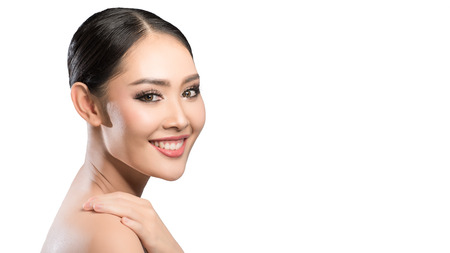 Beauty shot of young pretty asian woman with clear skin ongrey background, for skin ad and cosmetology with copy space for text insertionの写真素材