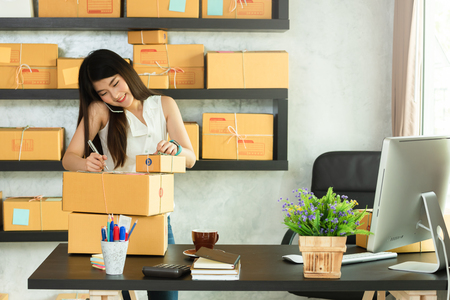 Young asian woman entrepreneur, teenager business owner work at home, alpha generation life style, online business conceptualの写真素材