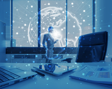 businessman use tablet with graphic effect of technology globalization conceptの写真素材
