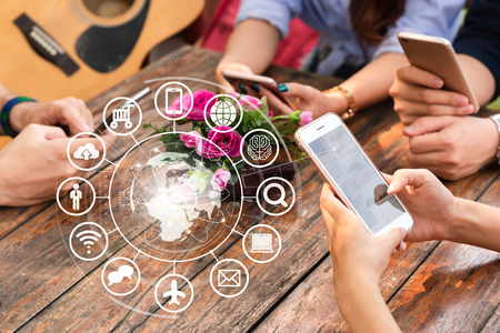 Hands of people use smartphone for connecting to various application, internet of things conceptualの写真素材