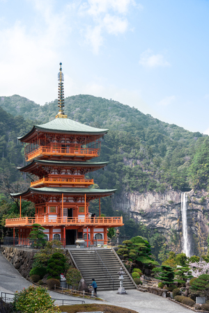 Nachi Taisha in Kumano Kodo pilgrimage routes, the tallest water fall in Japan with three strolley pagoda in sakura or cherry blossom seasonのeditorial素材
