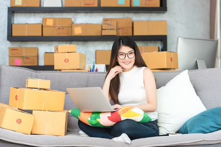 Young asian woman entrepreneur, teenager business owner work at home, alpha generation life style, online business conceptualの写真素材