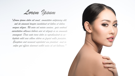 Beauty shot of young pretty asian woman with clear skin ongrey background, for skin ad and cosmetology with copy space for text insertionの写真素材