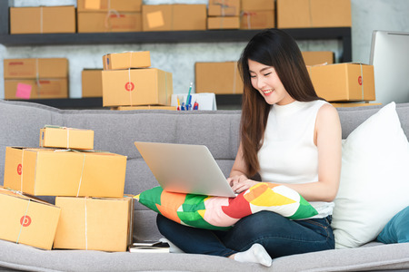Young asian woman entrepreneur, teenager business owner work at home, alpha generation life style, online business conceptualの写真素材