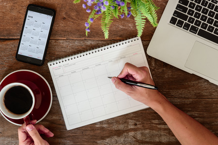 SEPTEMBER 17, 2018: Working table top with organizer for monthly planing with Iphone 8 plus use calendar application with year 2019のeditorial素材
