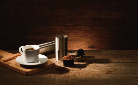 A shot of espresso with roasted coffee bean, grounded and  coffee grinderの写真素材