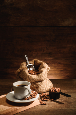 A shot of espresso with roasted coffee beanの写真素材