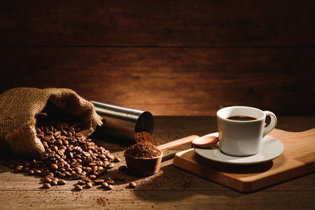 A shot of espresso with roasted coffee bean, grounded and  coffee grinderの写真素材
