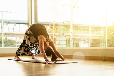A yoga master practicing yoga performing triangle poseの写真素材