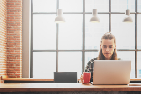 freelance working in coffee shop, Nomad worker conceptualの写真素材