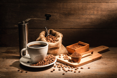 A cup of black coffee or americano with roasted coffee bean in bag, good coffee for health is black coffee without sugar and milkの写真素材