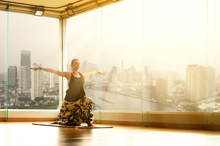 A yoga master practicing yoga performing a stand pose stretchingの写真素材