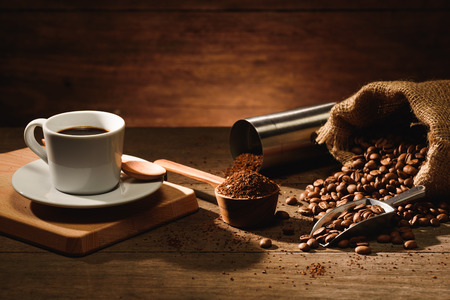 A shot of espresso with roasted coffee bean, grounded and old vintage coffee grinderの写真素材