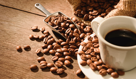 A shot of espresso with roasted coffee beanの写真素材