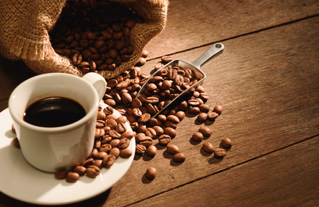 A shot of espresso with roasted coffee beanの写真素材