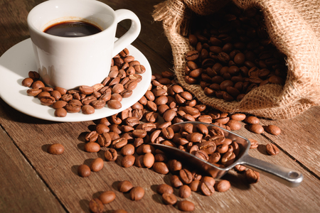 A shot of espresso with roasted coffee beanの写真素材