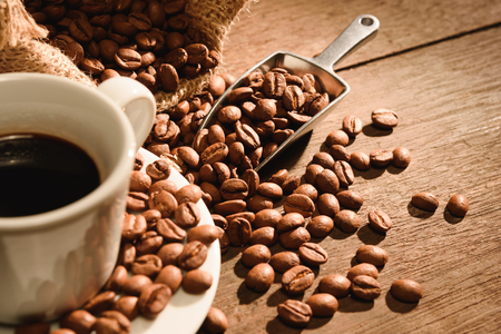 A shot of espresso with roasted coffee beanの写真素材