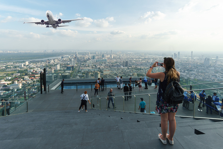 Traveler take photo of panorama view on rooftop of buildingのeditorial素材