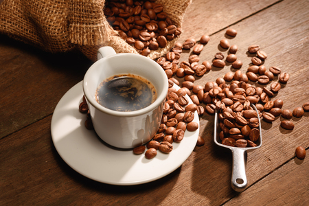 A shot of espresso with roasted coffee beanの写真素材