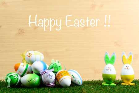 Easter decorative background on grass and wooden floorの写真素材