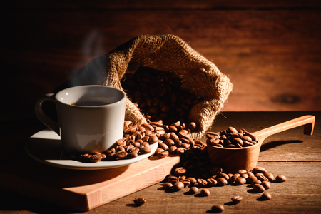 A shot of espresso with roasted coffee beanの写真素材