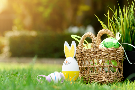 Decorative eggs on green grass for Easter celebrationの写真素材