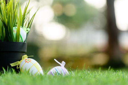 Decorated Eggs lay on grass prepared for Easter celebration