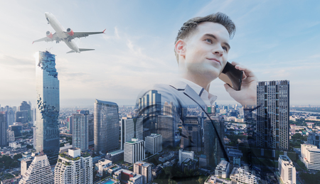 Double exposure of business man call via cell phoneの写真素材